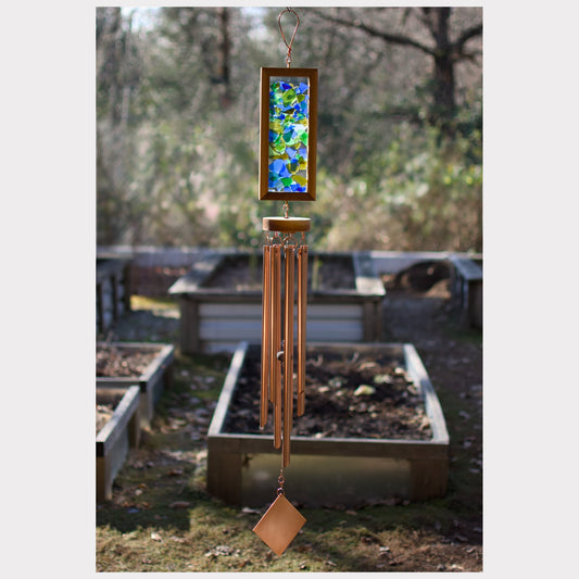 Large kaleidoscope wind chime featuring beach glass and seven copper chimes.