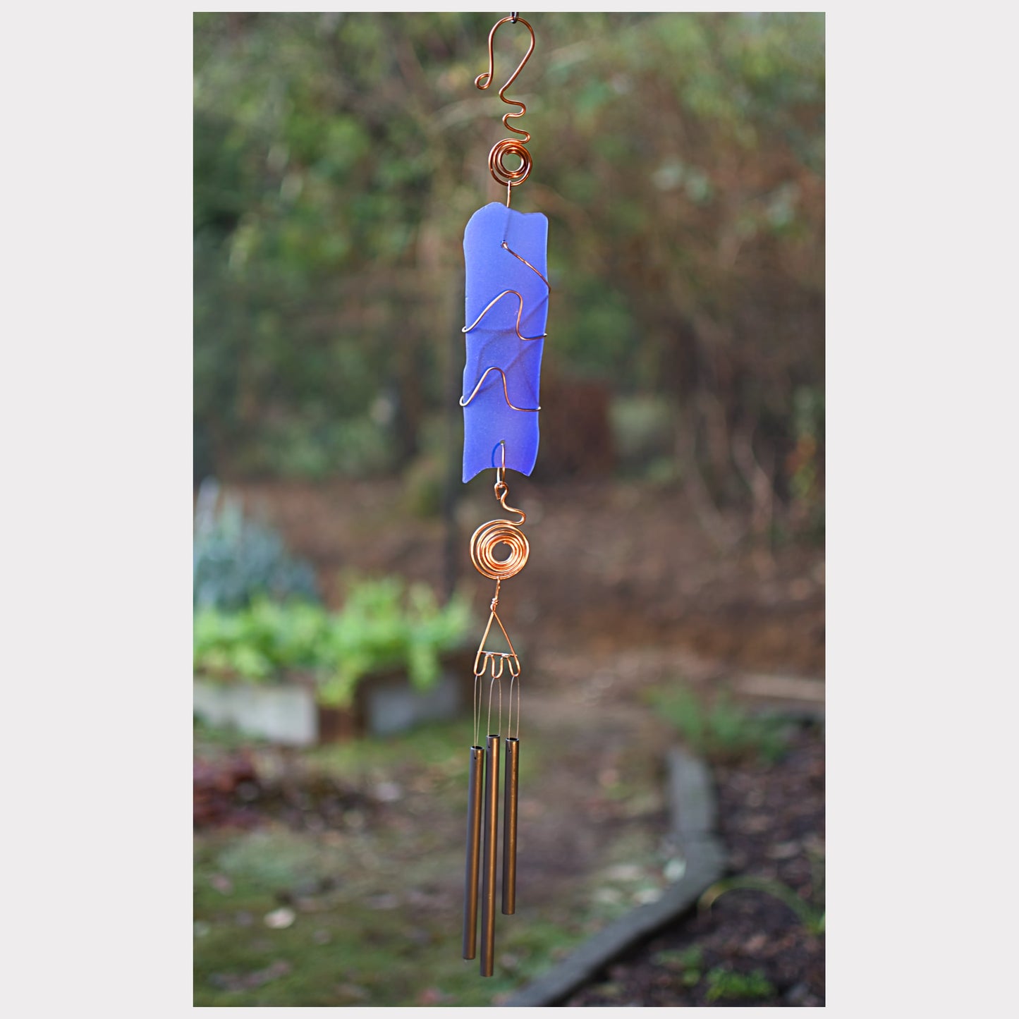 Fancy cobalt blue beach glass wind chime with three antiqued brass chimes.